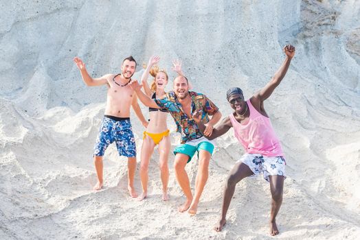 Four young adults waving and moving in swimsuit. horizontal background