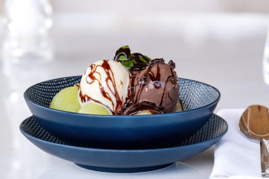 Fruit ice cream on melon balls on marble table