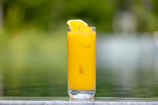 Refreshing citrus and alcoholic cocktail on dark background