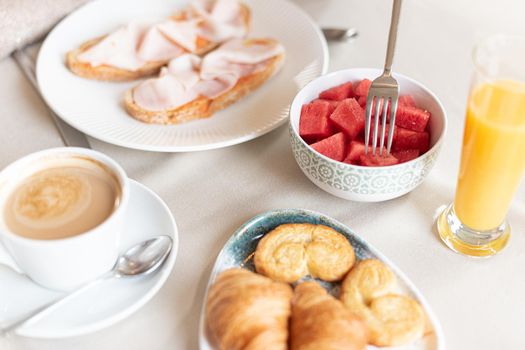 Close up view of a breakfast served at a table in a hotel dining room. Concept of breakfast in hotel.