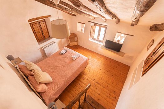 View from above of a cozy bedroom of a rural hotel in Almeria, Spain. Concept of travel and lodging.