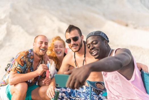 four friends having fun and posing for a selfie, front view