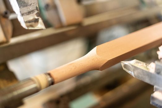 wooden baluster lathe, unfocused background, molded wood