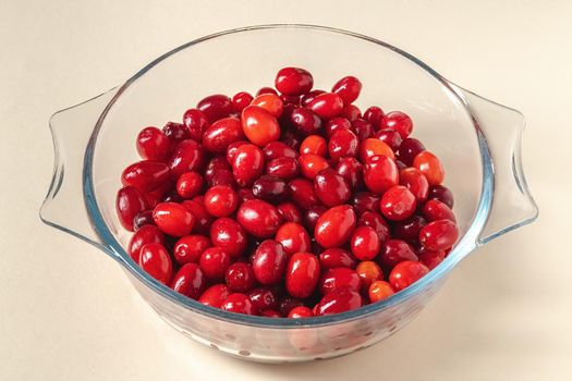 Fresh cranberries in a glass bowl. Healthy eating concept