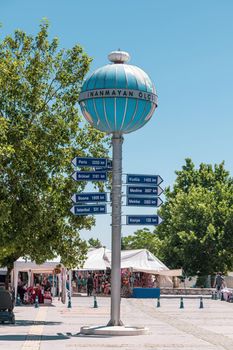 Aksehir, Turkey - July 04, 2022: Aksehir Nasreddin Hoca Square, the Infidel Measures Monument and the distance sign to different cities on it