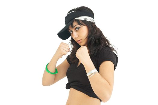 Studio portrait of a young woman in boxing guard position and confident attitude in white background