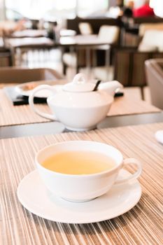 Healthy nutrition, relax and detox concept - Green herbal tea in a restaurant, five o'clock