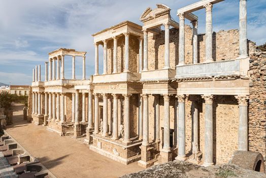 Ruins of front part of aged stone Roman theater with columns located in Spain in daylight