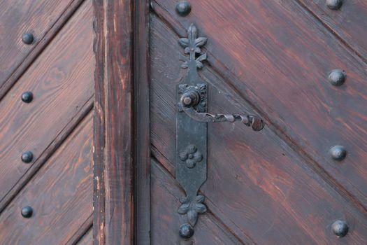 Beautiful old door with iron handle