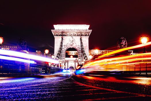 View to Chain bridge and city traffic. Beautiful evening or night scene of illuminating ancient architecture