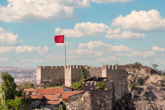 Ankara Castle with the Turkish flag flying over it. Turkish name is Ankara Kalesi