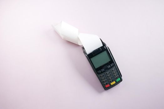POS machine and long rolling paper on blue