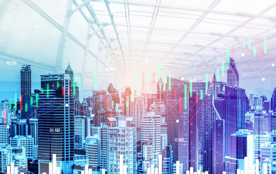 Financial graphs and digital indicators overlap with modernistic urban area, skyscrabber for stock market business concept. Double exposure.