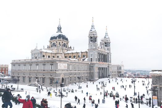 Almudena Cathedral in Madrid on a winter day after a heavy snowfall.