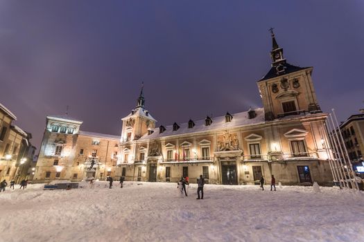 Plaza de la Villa in Madrid on a winter night after a heavy snowfall.