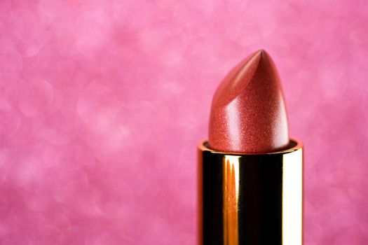 Lipstick on pink background. Showcase or advertisement for beauty brand, Concept of fashion, cosmetics with copy space. High quality
