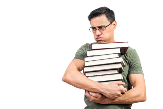 Exhausted man in glasses carrying pile of textbooks and exhaling during exam preparation against white background