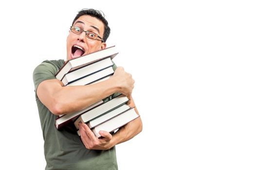 Happy man in glasses looking at camera and yelling in excitement while hugging favorite books against white background