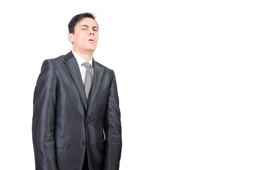 Suspicious male in classy suit and tie looking at camera with doubtful face expression against white background