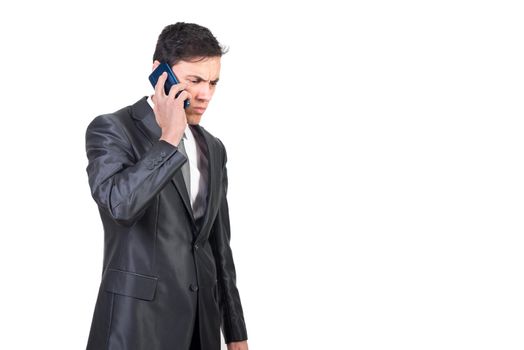 Concentrated male entrepreneur talking on mobile phone bad news and feeling frustration and anxiety