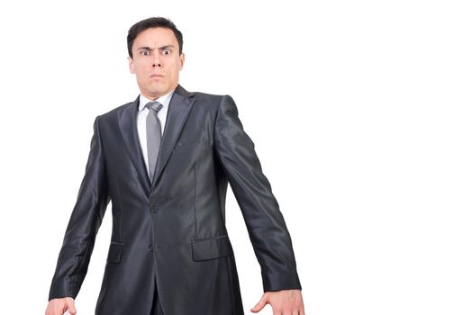 Serious male entrepreneur in elegant outfit frowning and looking at camera with astonished face isolated on white background in studio