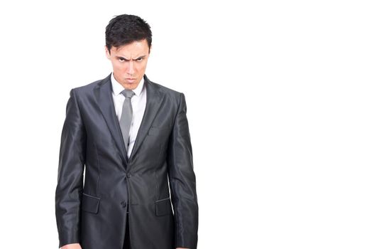 Serious male in classy suit frowning face and gazing at camera with angry negative expression isolated on white background