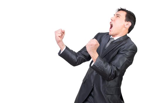 Delighted expressive young male manager with dark hair in formal outfit clenching fists and screaming happily while celebrating achievement against white background