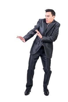 Full body of frightened man with scared face in formal suit standing isolated on white background in modern light studio