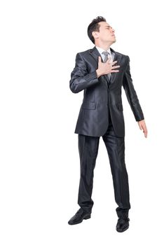 Comic male entrepreneur in formal clothes touching chest and feeling pain on white isolated background