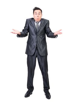 Full length of doubting male manager in suit shrugging shoulders and looking at camera on white isolated background in studio