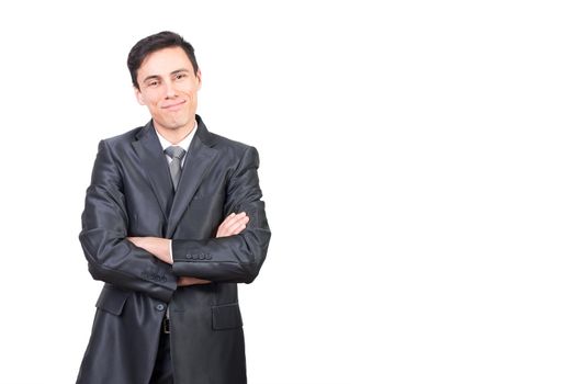 Cheerful male entrepreneur in elegant outfit looking at camera with smile while standing with crossed arms isolated on white background