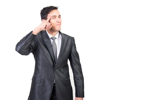 Smart male in elegant outfit making think gesture and pointing to head while looking at camera isolated on white background