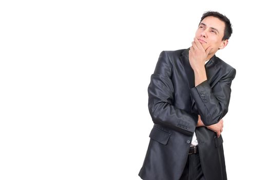 Pensive male in formal outfit looking up with dreamy face and hand at chin isolated on white background in studio