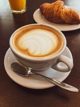 Breakfast, food and drinks and service concept - Cappuccino in a restaurant, at a coffee break