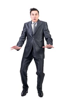 Full body of shocked male in elegant suit looking at camera with astonished face expression isolated on white background in studio