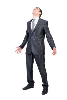 Full body of relaxed and happy male manager in formal suit closing eyes from pleasure while breathing with outstretched arms in studio against white background