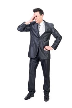 Full body of male in pain wearing elegant suit suffering from headache with closed eyes isolated on white background in studio