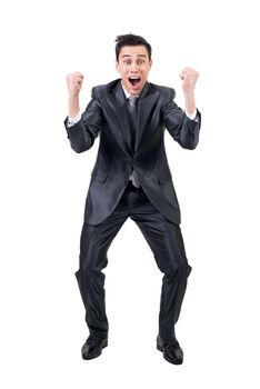 Full body of delighted male in formal suit looking at camera with clenched fists while screaming isolated on white background