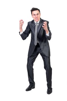 Full body of stressed male entrepreneur grimacing and screaming on white background while looking at camera