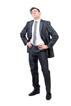 Full body of haughty man in formal suit looking at camera with hands on waist isolated on white background in studio