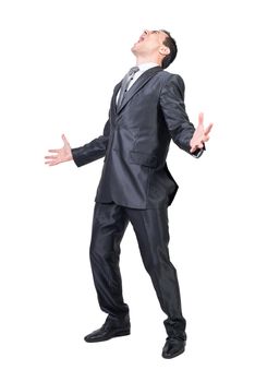 Full length of furious well dressed male entrepreneur in suit shouting on white background in studio