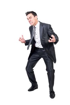 Full length of irritated male entrepreneur in formal wear making angry face and looking at camera on white background