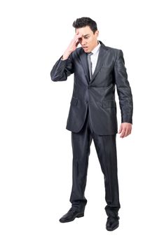 Anxious male manager in suit touching forehead and showing forget gesture on white background in studio