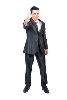 Full length of delighted male entrepreneur in classy suit showing thumb up and expressing approval while looking at camera on white background