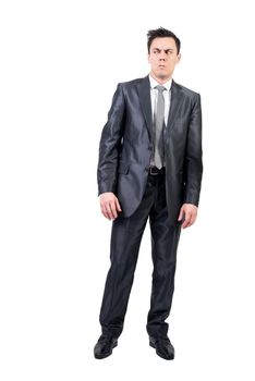 Full body of distrusted male in elegant suit looking away with doubtful face expression isolated on white background in studio