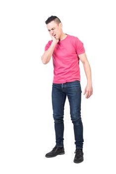 Man in casual clothes touching cheek and closing eyes while suffering from toothache against white background