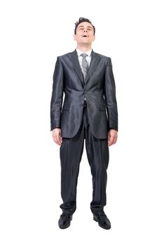 Full body of male worker in formal suit chilling and opening mouth from pleasure in studio against white background