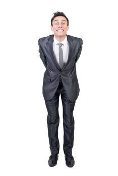 Full body of successful male in formal suit leaning forward and looking at camera with smile isolated on white background in studio