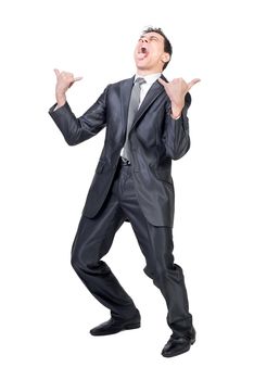 Full body of rage male in formal outfit gesturing horns and screaming with opened mouth and closed eyes against white background