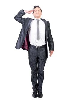 Full body of male soldier in elegant suit saluting and looking at camera with serious face isolated on white background